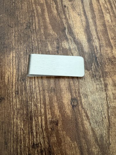 Looking for the perfect gift for him? This Stainless Steel Slim Money Clip with Leather offers a blend of modern style and practical function